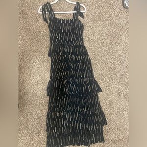 Black tiered dress with gold detail
